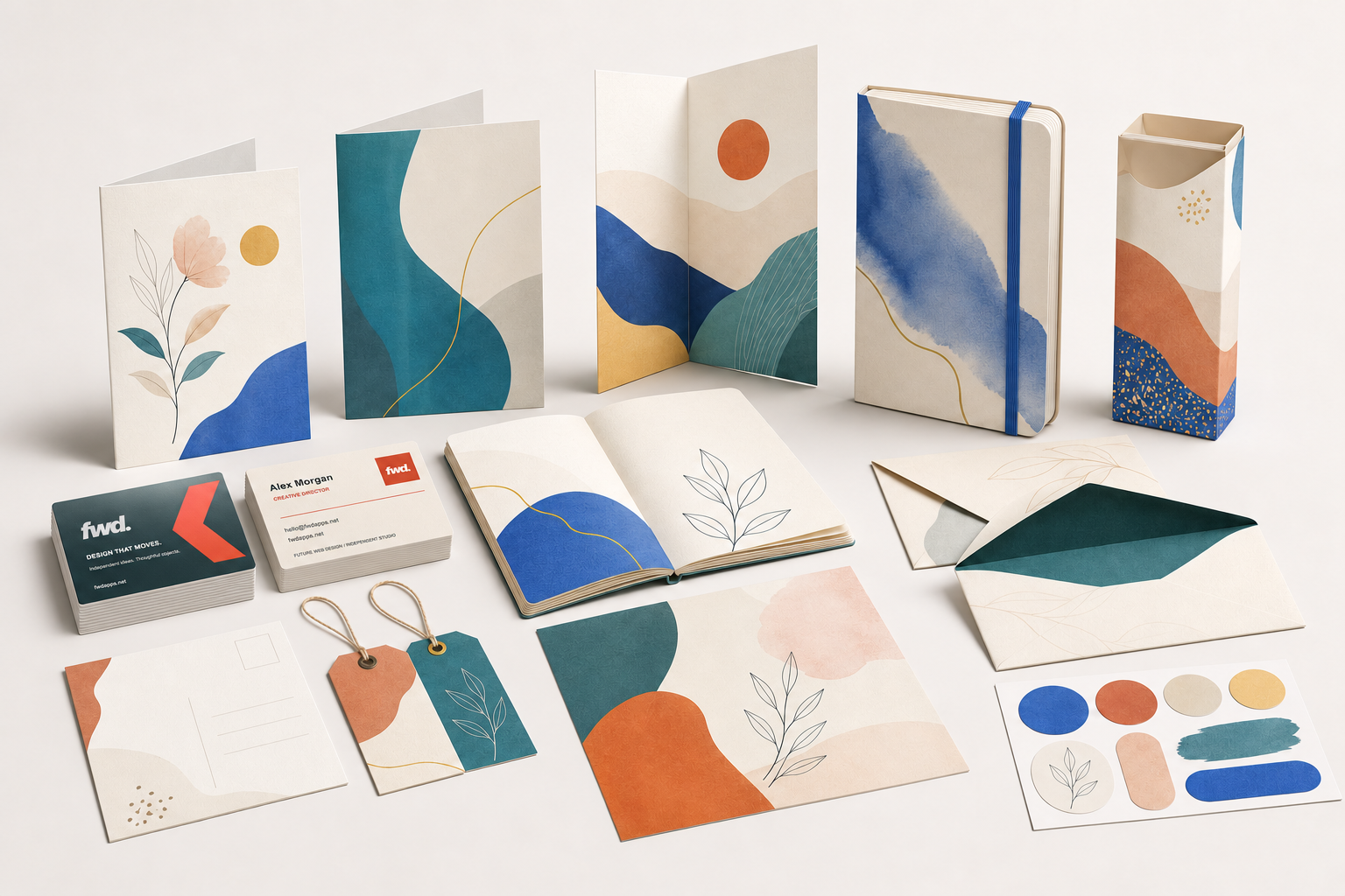 Paper stationery collection including the front and back of our FWD business card with a foil-paper finish